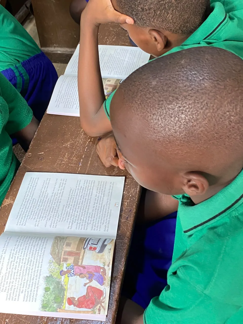 Learners reading Phonics Train books in class
